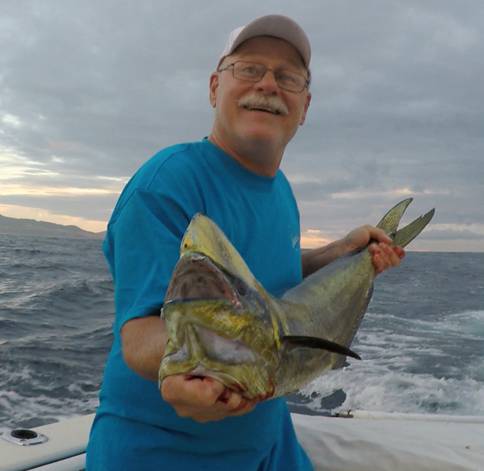 A tourist fishing in the deep waters of Cabo San Lucas.